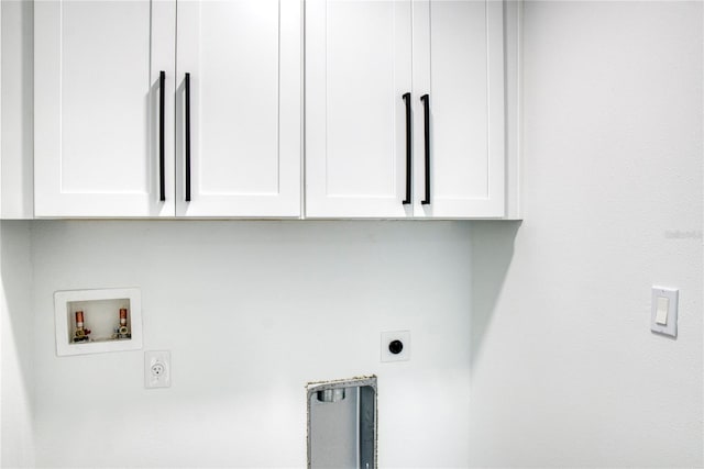 laundry room featuring cabinets, electric dryer hookup, and washer hookup