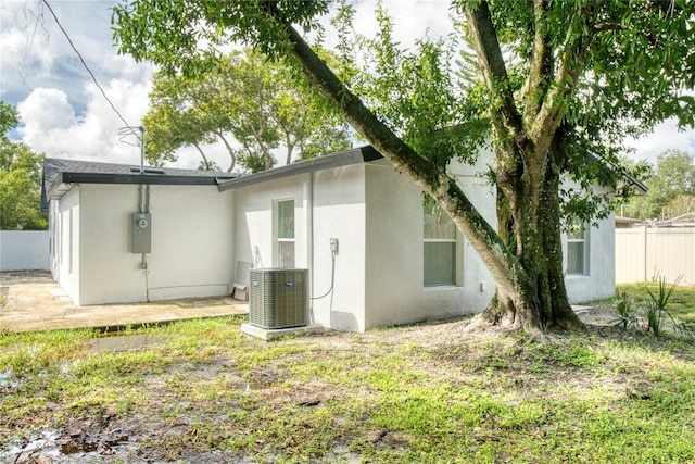 back of property with central AC unit