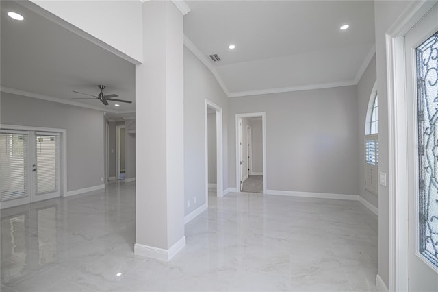 spare room with ornamental molding, vaulted ceiling, ceiling fan, and french doors