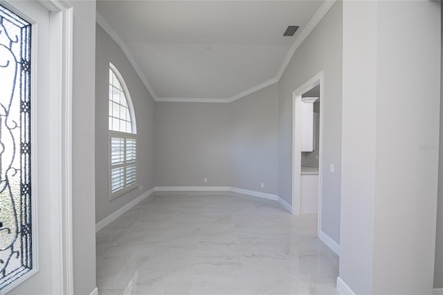 unfurnished room featuring crown molding