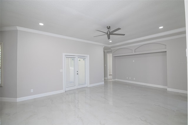 empty room featuring ceiling fan, crown molding, and a textured ceiling