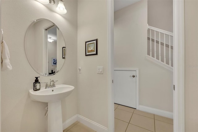 bathroom with tile patterned flooring