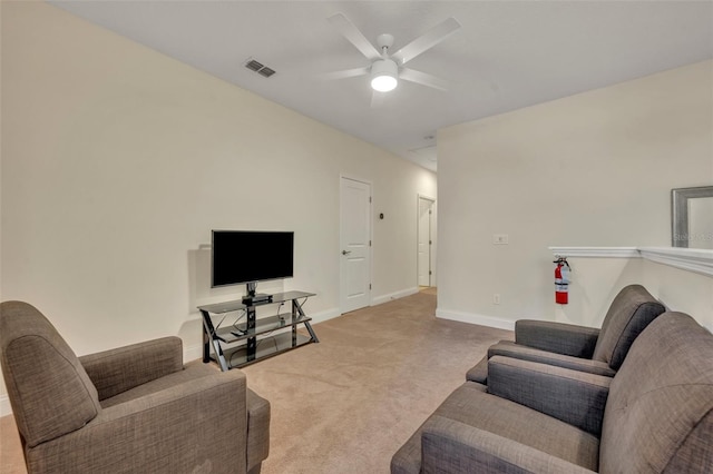 living room with ceiling fan and carpet floors