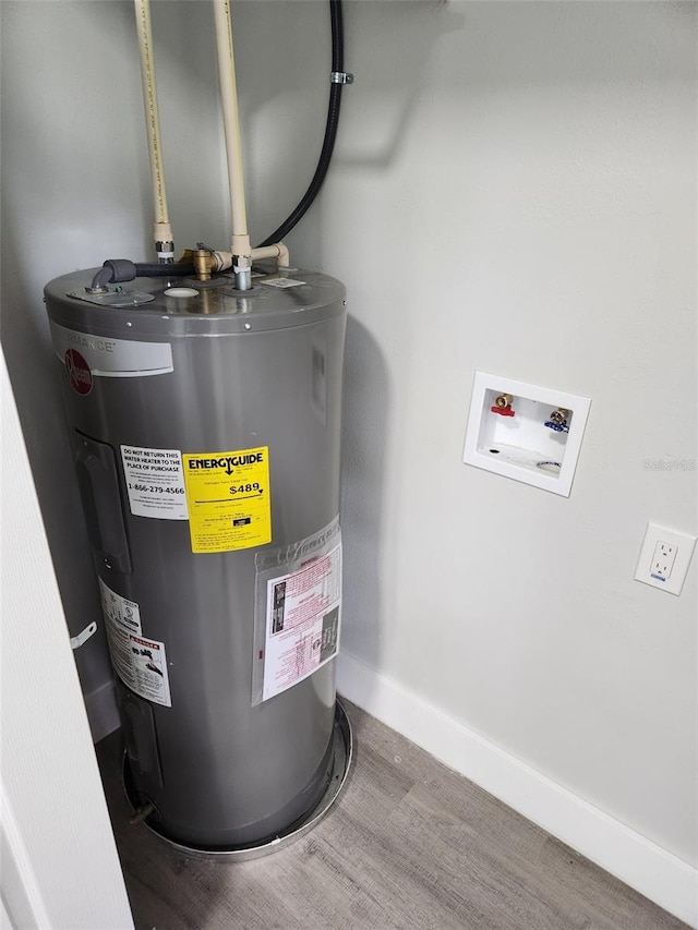 utility room featuring electric water heater