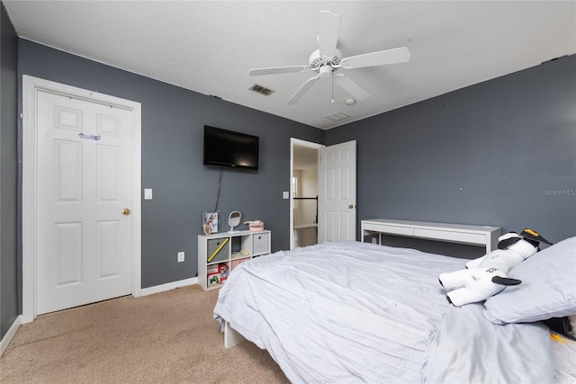 carpeted bedroom featuring ceiling fan