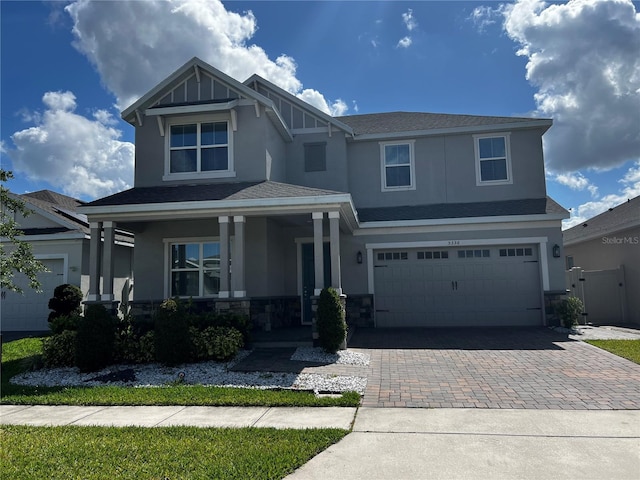 view of front of house featuring a garage and a porch