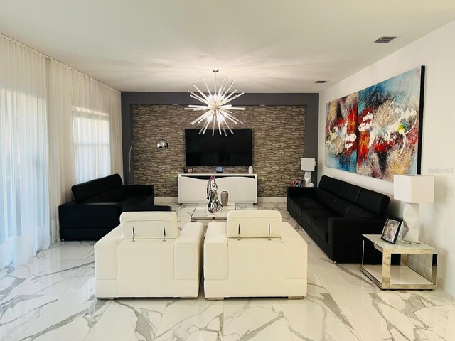 living room featuring a notable chandelier