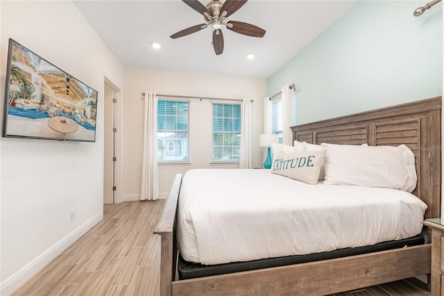 bedroom with light hardwood / wood-style flooring and ceiling fan