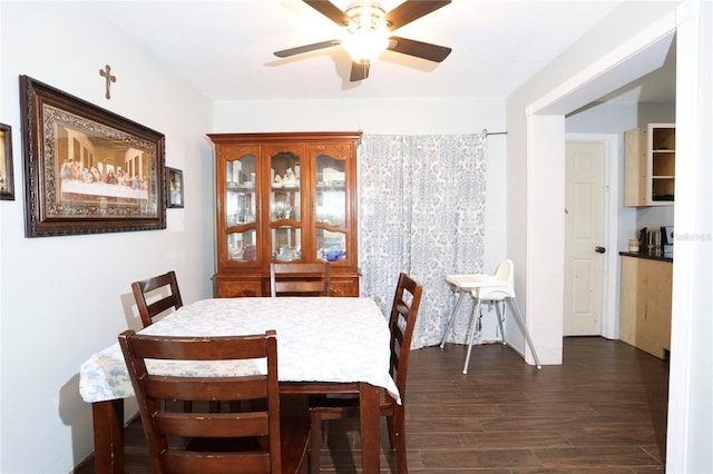 dining room featuring dark wood-style floors and ceiling fan