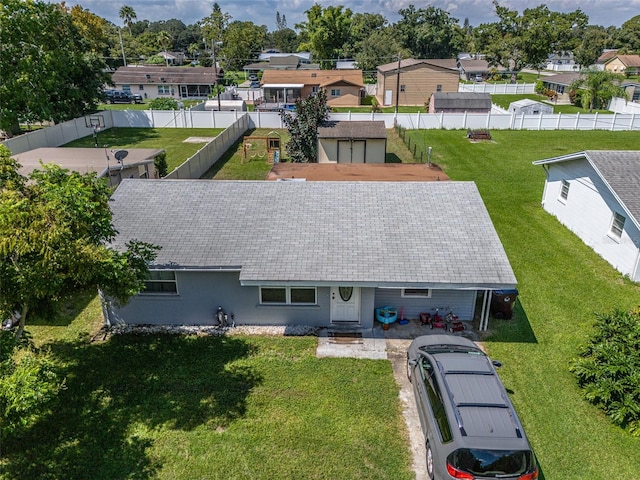 birds eye view of property with a residential view