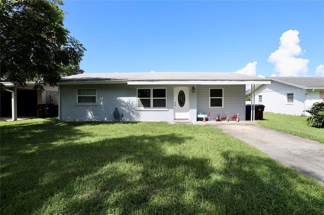 ranch-style home featuring covered porch and a front yard