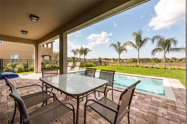 view of patio / terrace featuring a fenced in pool