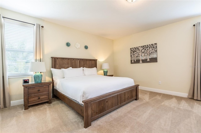 bedroom with light colored carpet