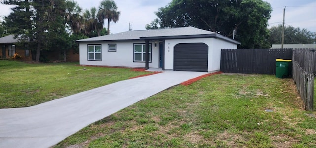 single story home with a garage and a front yard