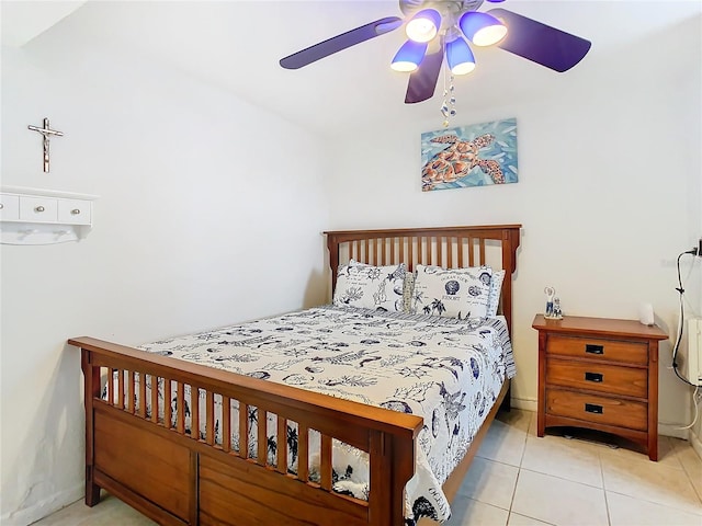 tiled bedroom with ceiling fan