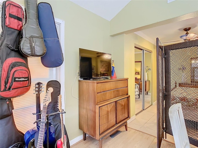 interior space featuring vaulted ceiling and a closet