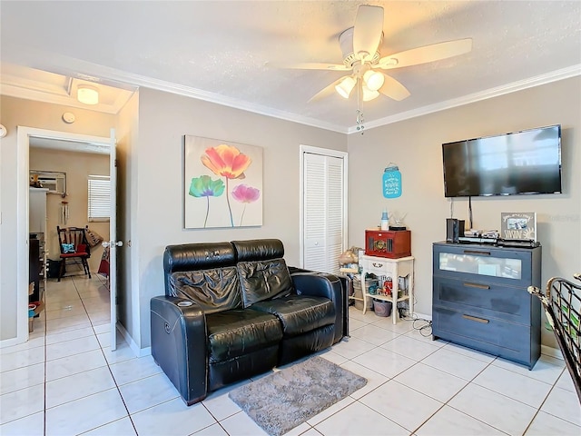 living room featuring ceiling fan, light tile patterned floors, and crown molding