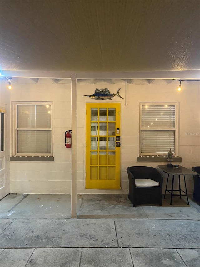 doorway to property featuring a patio area