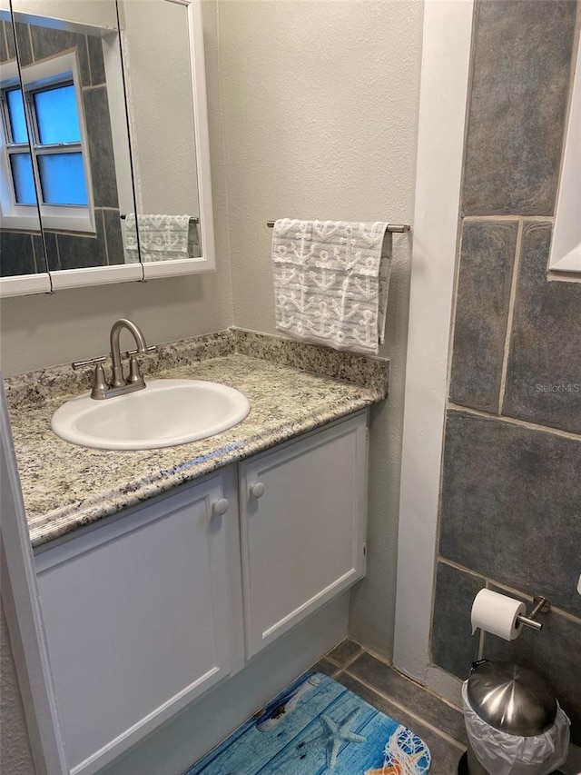 bathroom with vanity and tile patterned flooring