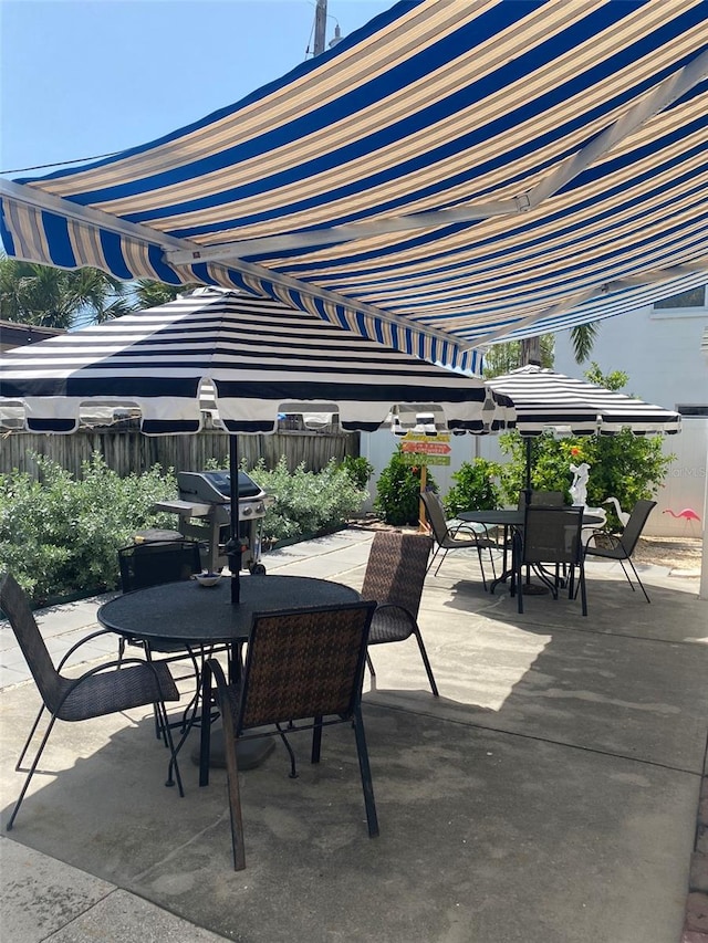 view of patio featuring a grill