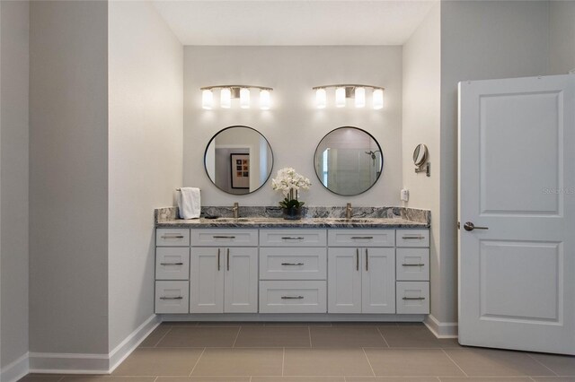 bathroom with tile patterned flooring and vanity