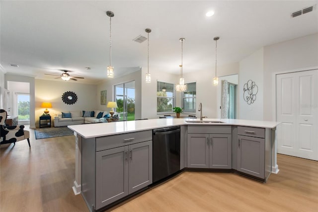 kitchen featuring ceiling fan, plenty of natural light, sink, and stainless steel dishwasher