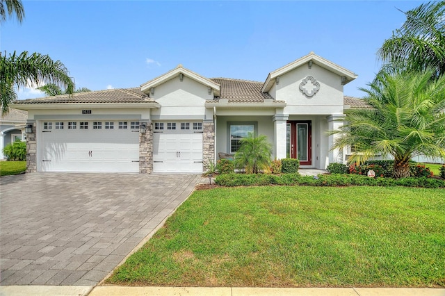 mediterranean / spanish-style home featuring a garage and a front lawn