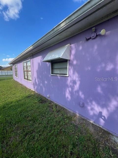 view of property exterior featuring a yard