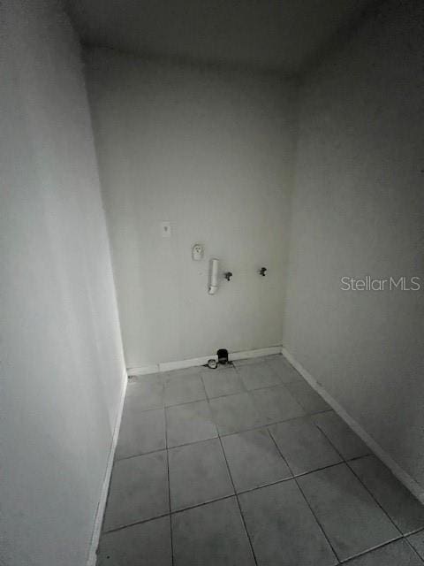 laundry area featuring light tile patterned flooring