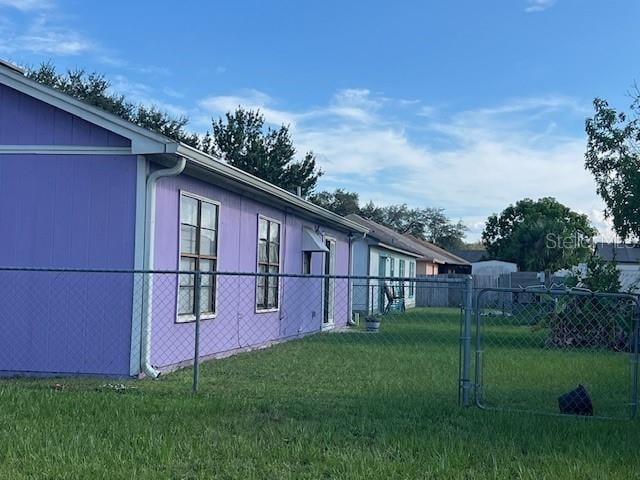 view of home's exterior with a lawn