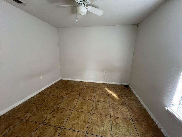 spare room with ceiling fan