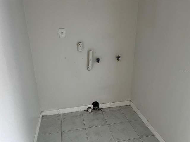 washroom with hookup for a gas dryer and hookup for an electric dryer