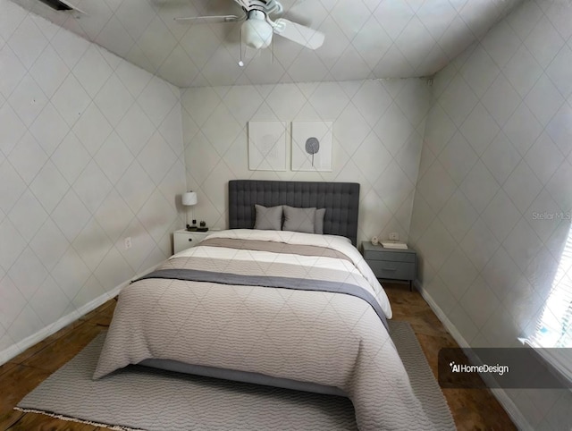 bedroom with ceiling fan and dark wood-type flooring