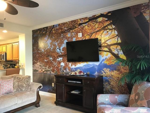 living room with light tile patterned floors, ornamental molding, and ceiling fan