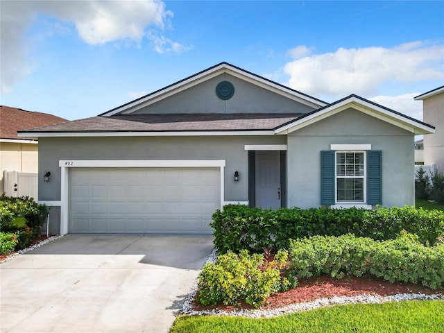 ranch-style house featuring a garage