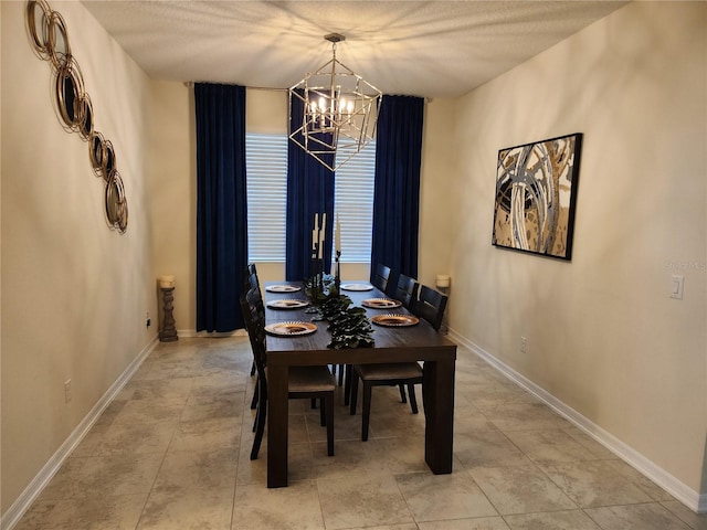 dining area featuring a notable chandelier