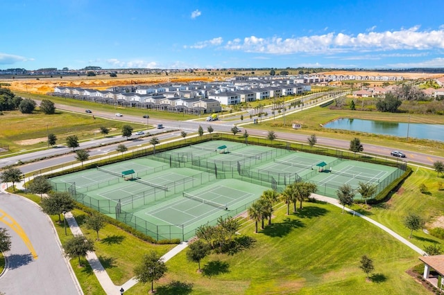 drone / aerial view featuring a residential view and a water view