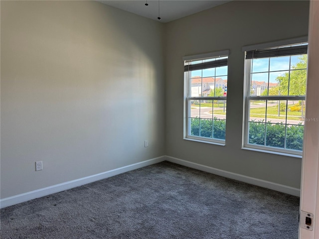 1077 Quaker Ridge Ln, Davenport, FL 33896 - empty room featuring carpet floors and baseboards
