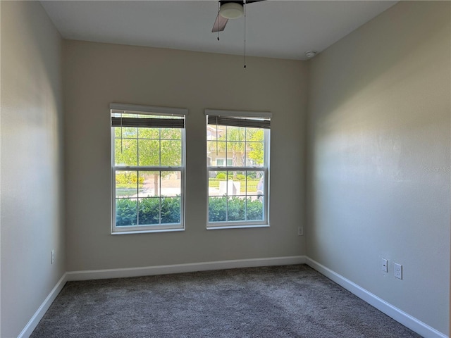 1077 Quaker Ridge Ln, Davenport, FL 33896 - carpeted empty room featuring baseboards and ceiling fan