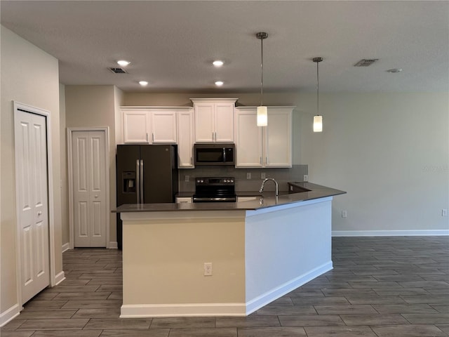 1077 Quaker Ridge Ln, Davenport, FL 33896 - kitchen featuring black appliances, baseboards, white cabinetry, and wood tiled floor