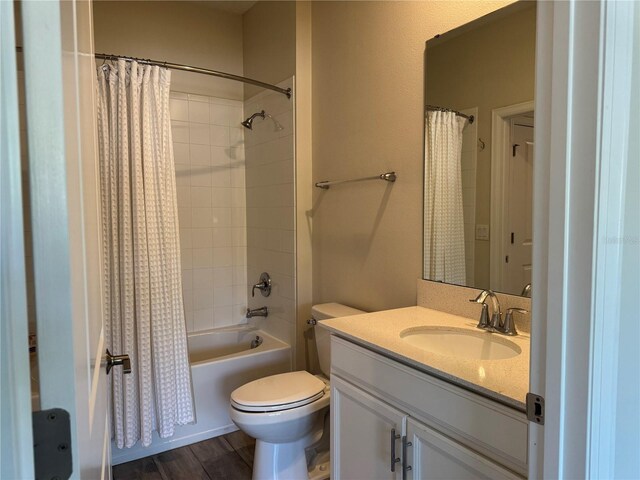 1077 Quaker Ridge Ln, Davenport, FL 33896 - full bathroom featuring toilet, vanity, wood finished floors, and shower / bathtub combination with curtain