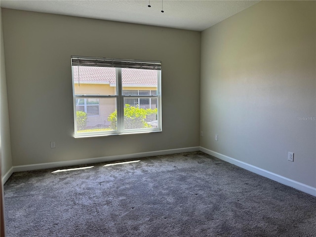 1077 Quaker Ridge Ln, Davenport, FL 33896 - unfurnished room with carpet floors and baseboards