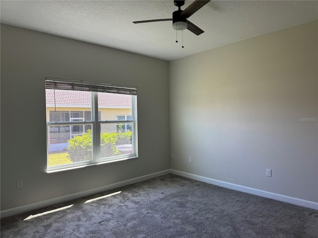1077 Quaker Ridge Ln, Davenport, FL 33896 - carpeted spare room featuring baseboards, a textured ceiling, and ceiling fan