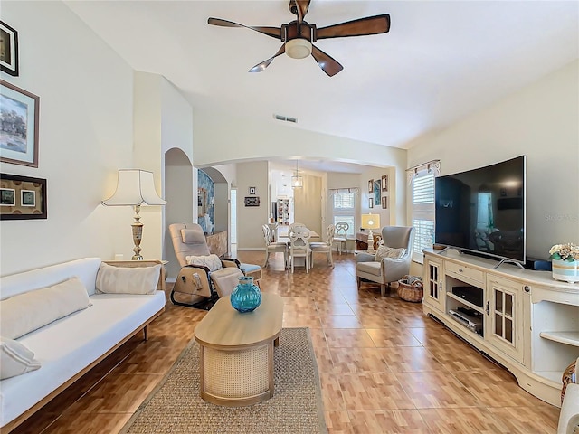 205 Bell Tower Xing W, Kissimmee, FL 34759 - living room featuring ceiling fan, lofted ceiling, and arched walkways