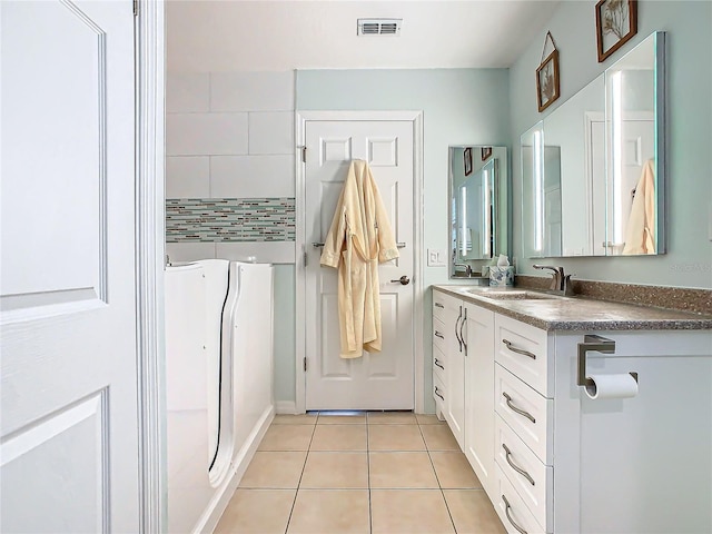 205 Bell Tower Xing W, Kissimmee, FL 34759 - full bath featuring tile patterned floors and double vanity