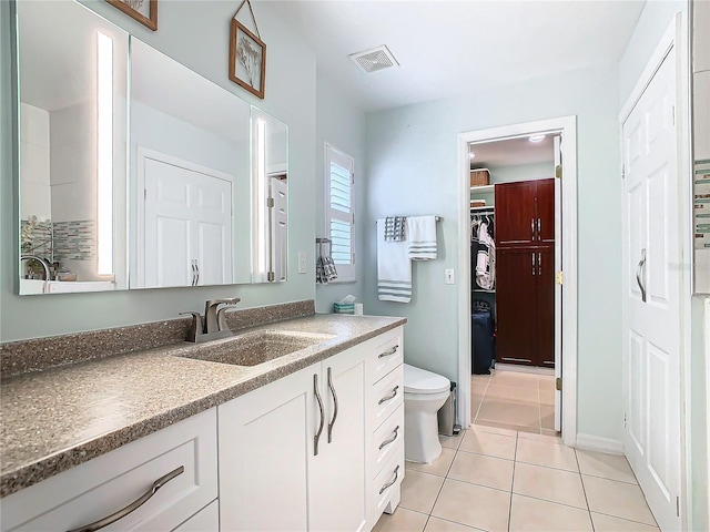 205 Bell Tower Xing W, Kissimmee, FL 34759 - bathroom featuring vanity, tile patterned floors, and a spacious closet