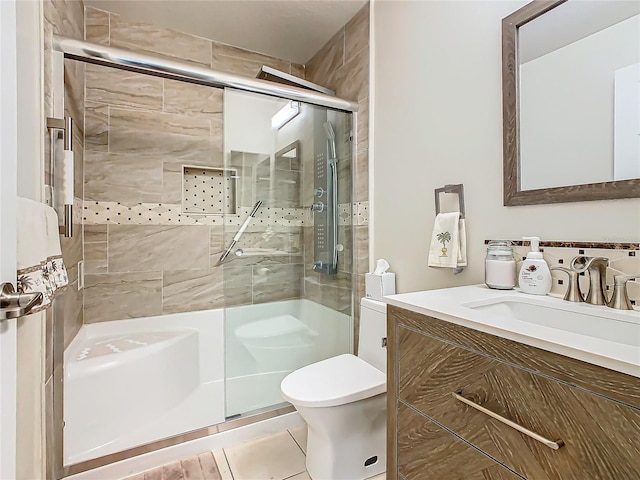 205 Bell Tower Xing W, Kissimmee, FL 34759 - full bathroom featuring a shower stall, vanity, and tile patterned flooring
