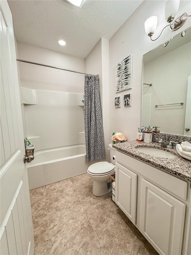 full bathroom with a textured ceiling, vanity, toilet, and shower / bathtub combination with curtain