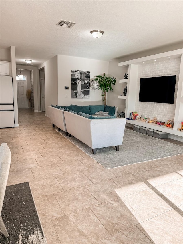 living room featuring a textured ceiling