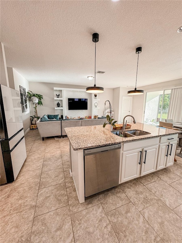 kitchen featuring a kitchen island with sink, pendant lighting, white cabinetry, dishwasher, and sink